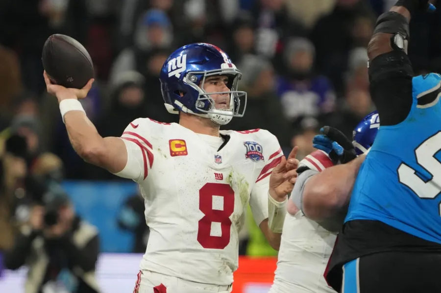 Nov 10, 2024; Munich, Germany; New York Giants quarterback Daniel Jones (8) throws the ball against the Carolina Panthers in the second half during the 2024 NFL Munich Game at Allianz Arena. Mandatory Credit: Kirby Lee-Imagn Images