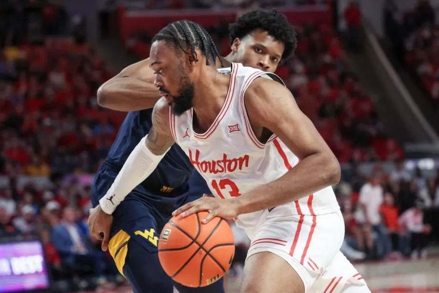 Jan 15, 2025; Houston, Texas, USA; Houston Cougars forward J'Wan Roberts (13) dribbles against West Virginia Mountaineers forward Amani Hansberry (13) in the first half at Fertitta Center. Mandatory Credit: Thomas Shea-Imagn Images