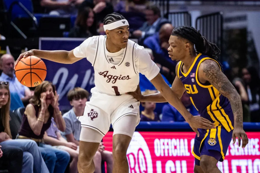 Mar 8, 2025; Baton Rouge, Louisiana, USA; Texas A&M Aggies guard Zhuric Phelps (1) dribbles against LSU Tigers guard Jordan Sears (1) during the first half at Pete Maravich Assembly Center. Mandatory Credit: Stephen Lew-Imagn Images