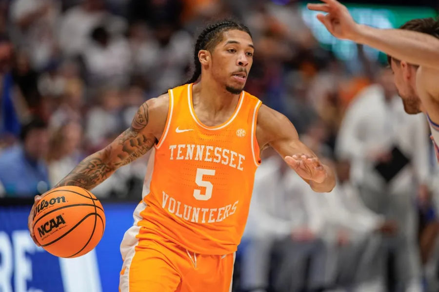 PHOTO USA TODAY SPORTS IMAGES Tennessee guard Zakai Zeigler (5) looks for a path around Florida defenders during the second half of the Southeastern Conference tournament championship at Bridgestone Arena in Nashville, Tenn., Sunday, March 16, 2025.