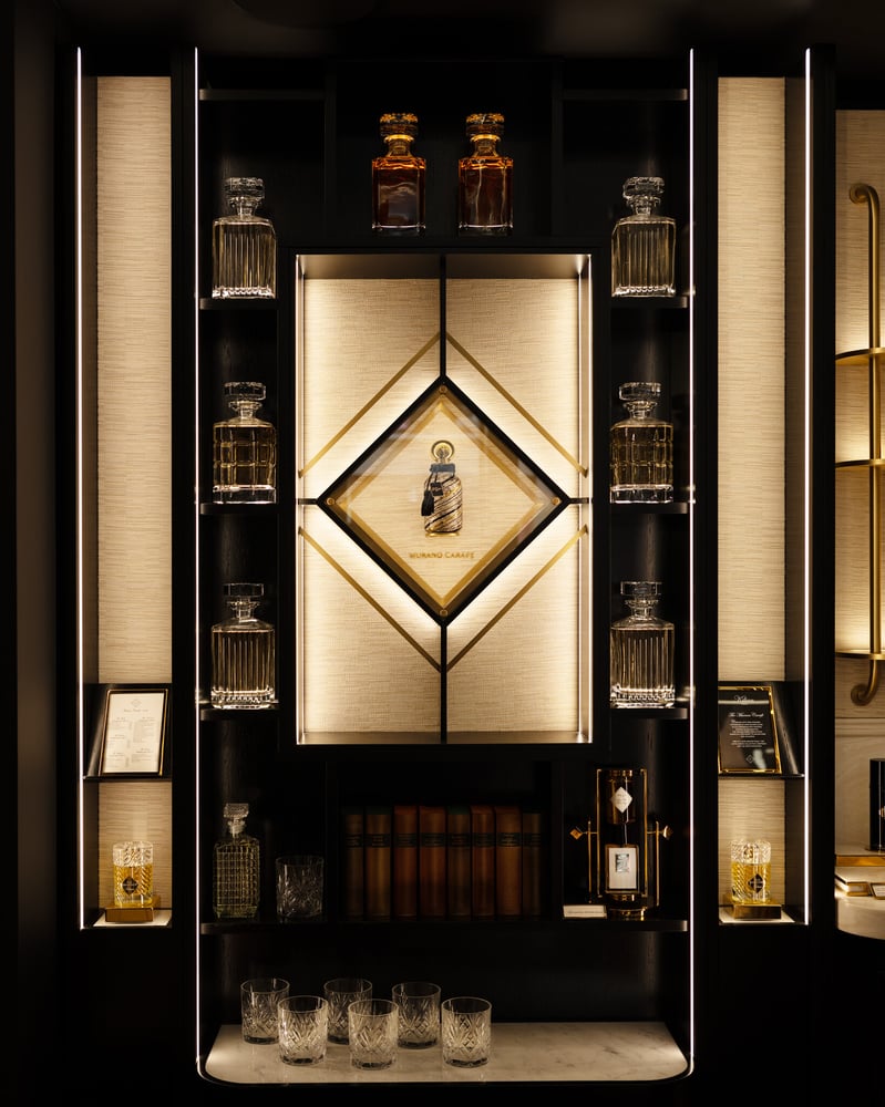 The refill wall at Kilian Paris' Marais boutique, blending luxury with sustainability.