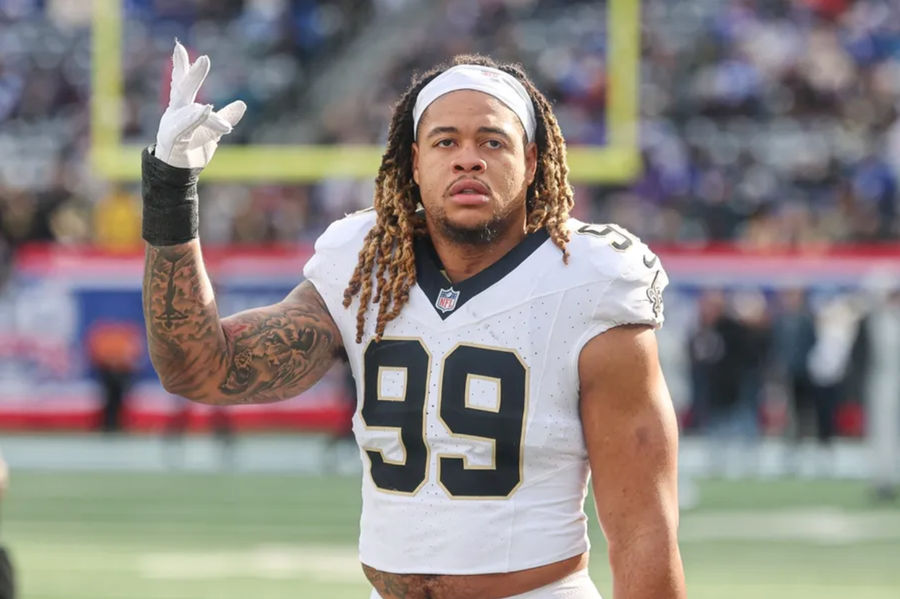 Dec 8, 2024; East Rutherford, New Jersey, USA; New Orleans Saints defensive end Chase Young (99) looks up at fans before the game against the New York Giants at MetLife Stadium. Mandatory Credit: Vincent Carchietta-Imagn Images