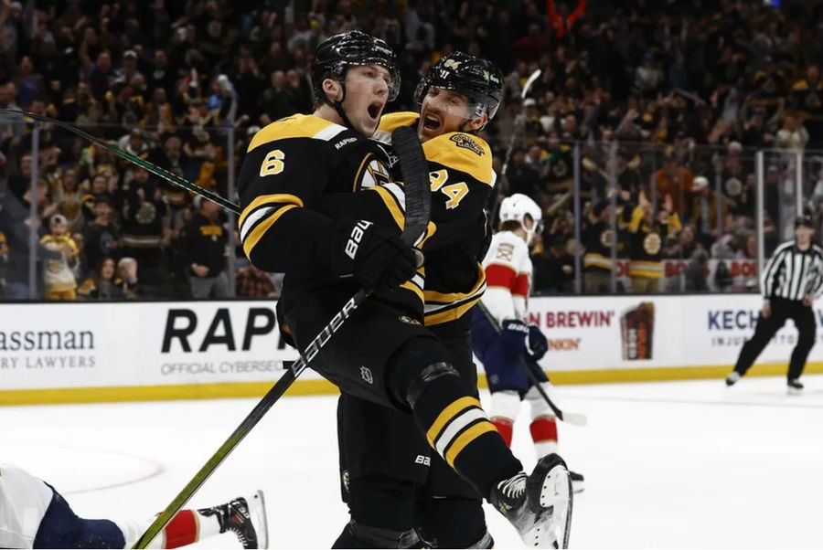 Mar 11, 2025; Boston, Massachusetts, USA; Boston Bruins defenseman Mason Lohrei (6) celebrates his game tying goal against the Florida Panthers with center Jakub Lauko (94) during the third period at TD Garden. Mandatory Credit: Winslow Townson-Imagn Images