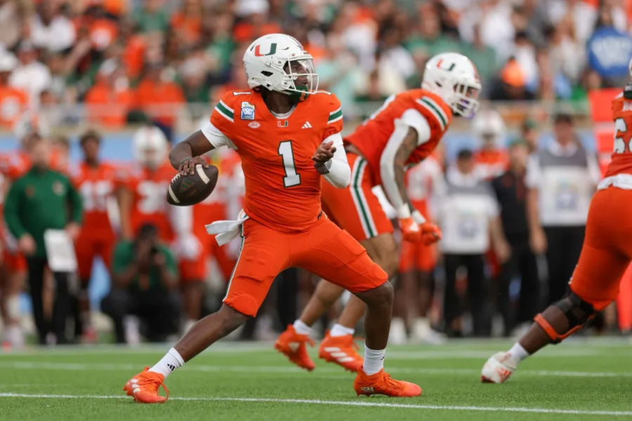 Miami Hurricanes quarterback Cam Ward (1) drops back to pass against the Iowa State Cyclones in the first quarter during the Pop Tarts bowl at Camping World Stadium. Mandatory Credit: Nathan Ray Seebeck-Imagn Images