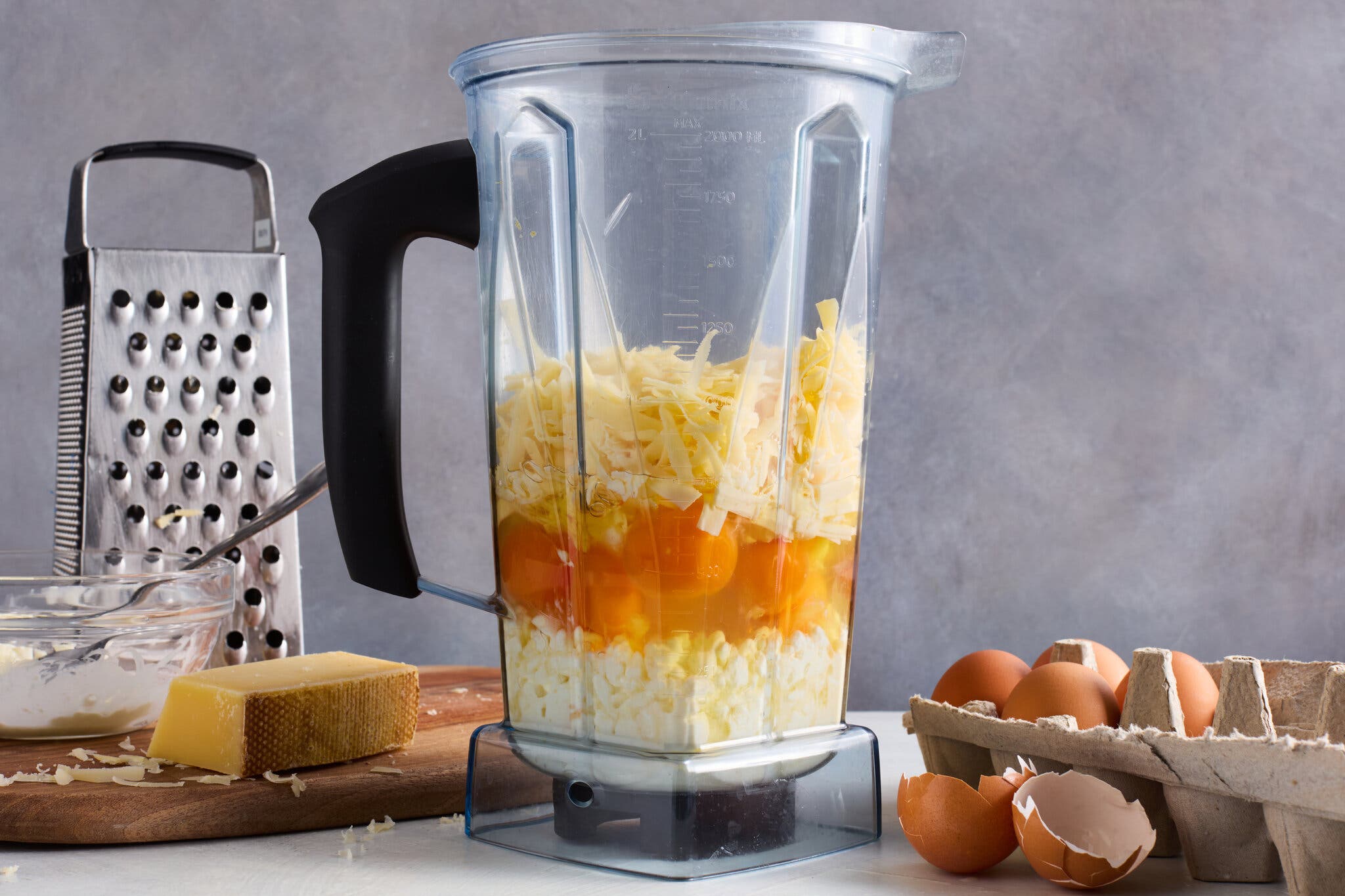 Eggs, shredded cheese and cottage cheese in a blender.