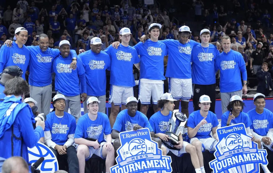 Mar 15, 2025; Charlotte, NC, USA; The Duke Blue Devils celebrate after winning the 2025 ACC Conference Championship game against the Louisville Cardinals at Spectrum Center. Mandatory Credit: Jim Dedmon-Imagn Images