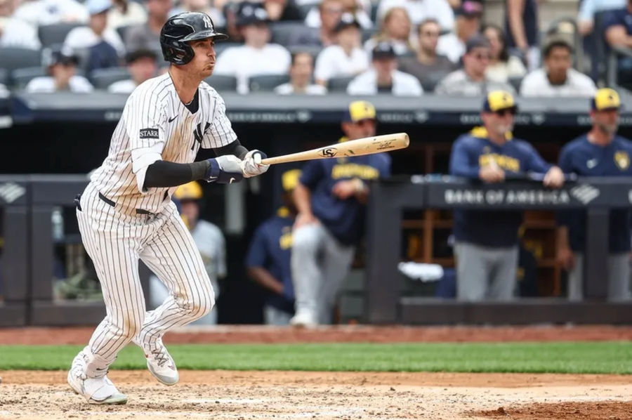 Mar 29, 2025; Bronx, New York, USA; New York Yankees left fielder Cody Bellinger (35) hits an RBI single in the sixth inning against the Milwaukee Brewers at Yankee Stadium. Mandatory Credit: Wendell Cruz-Imagn Images