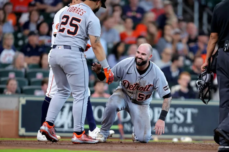 Apr 30, 2025; Houston, Texas, USA; Detroit Tigers catcher Tomas Nido (58) is helped up by Detroit Tigers second baseman Gleyber Torres (25) after scoring a run against the Houston Astros during the third inning at Daikin Park. Mandatory Credit: Erik Williams-Imagn Images