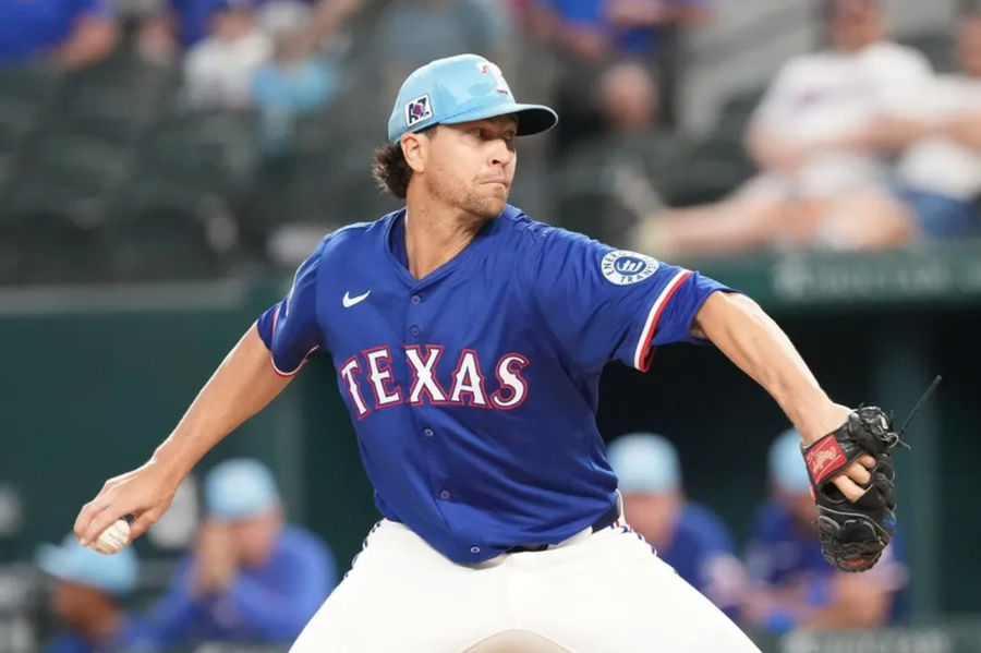 Mar 25, 2025; Arlington, Texas, USA; Texas Rangers starting pitcher Jacob deGrom (48) delivers a pitch to the Kansas City Royals in the third inning at Globe Life Field. Mandatory Credit: Jim Cowsert-Imagn Images
