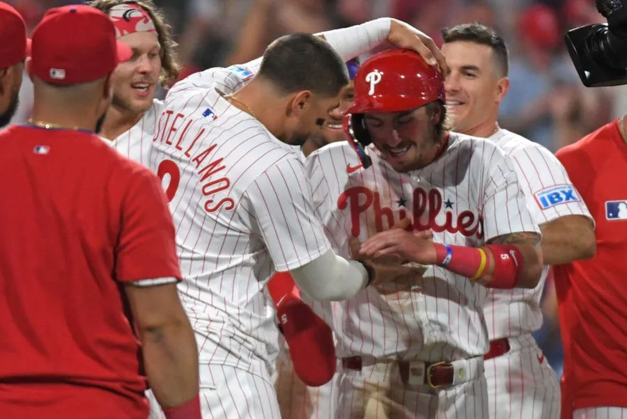 Apr 29, 2025; Philadelphia, Pennsylvania, USA; Philadelphia Phillies second base Bryson Stott (5) celebrates with outfielder Nick Castellanos (8) after scoring the winning run on a wild pitch during the ninth inning against the Washington Nationals at Citizens Bank Park. Mandatory Credit: Eric Hartline-Imagn Images