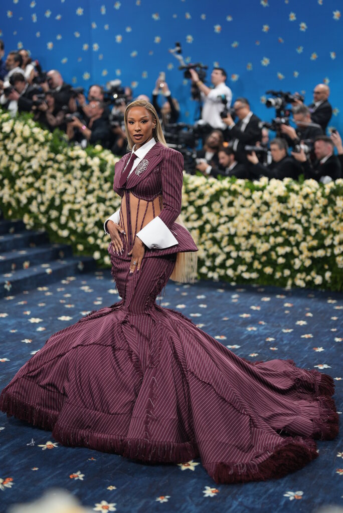 Savannah James wearing a maroon gown.