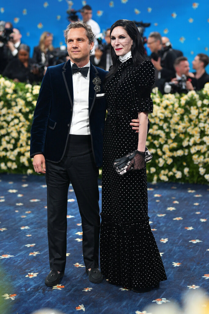 Harry Kargman is wearing a blue tuxedo and Jill Kargman is wearing a polka dot gown.