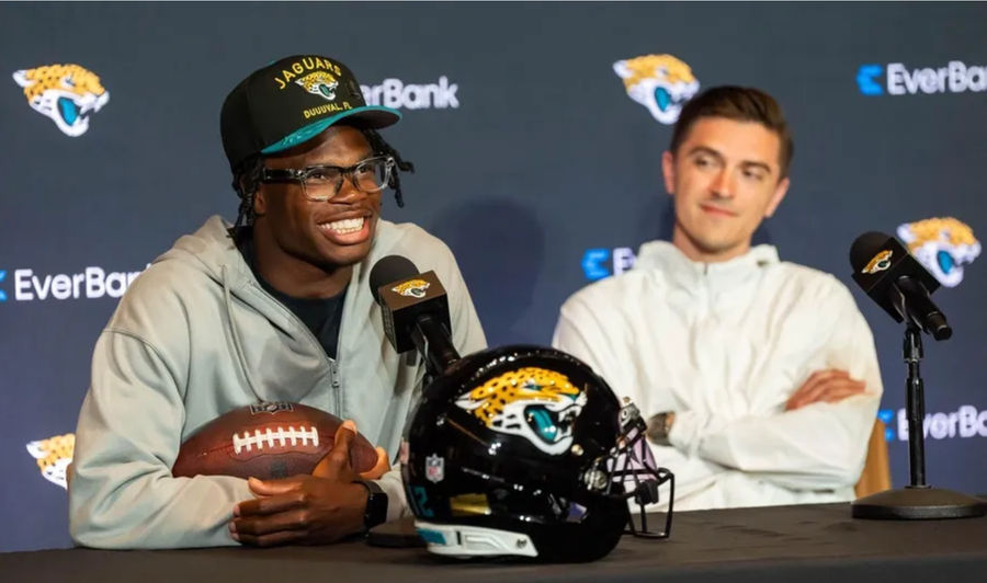 The Jacksonville Jaguars’ first-round pick, Colorado Buffaloes wide receiver and defensive back Travis Hunter, left, answers questions as General Manager James Gladstone, right, sits next to him during a press conference Friday, March 25, 2025 at Miller Electric Center in Jacksonville, Fla. [Doug Engle/Florida Times-Union]