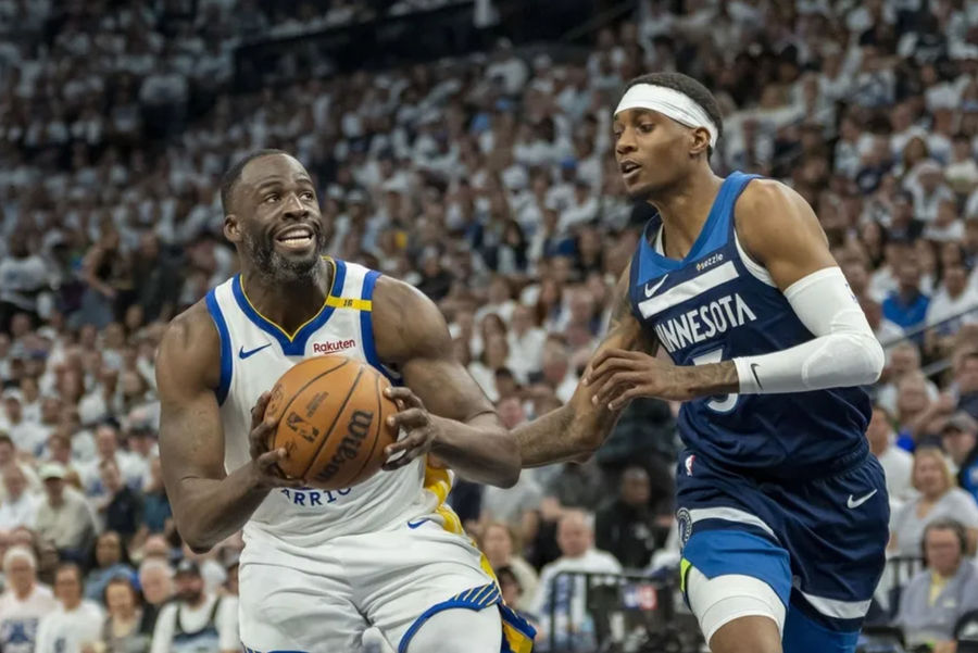 May 8, 2025; Minneapolis, Minnesota, USA; Golden State Warriors forward Draymond Green (23) drives to the basket past Minnesota Timberwolves forward Jaden McDaniels (3) in the second half during game two of the second round for the 2025 NBA Playoffs at Target Center. Mandatory Credit: Jesse Johnson-Imagn Images