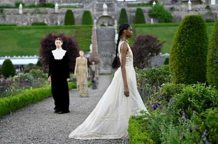 Models present looks during the Christian Dior cruise show at Drummond Castle in Scotland, June 3, 2024.