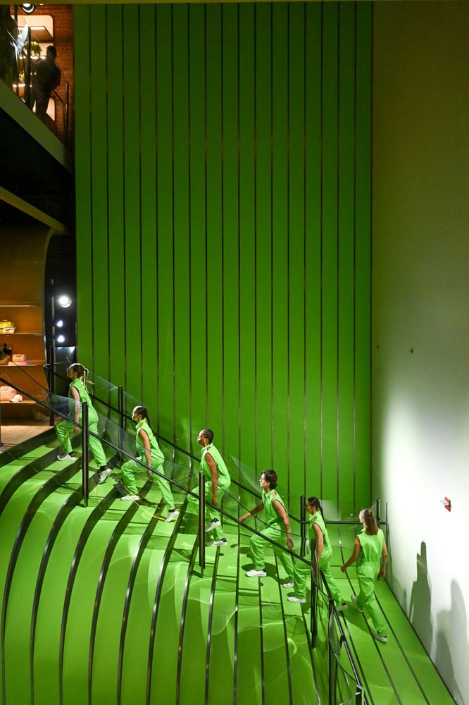 A view of Heatherwick's sculptural staircase at Longchamp's La Maison Unique, where fluid curves guide guests through the multi-level flagship.
