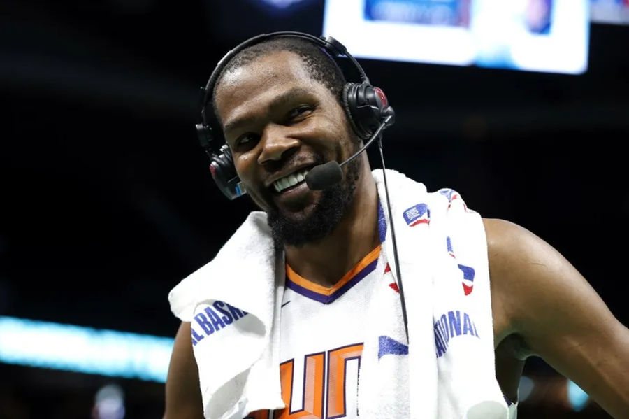 Mar 1, 2023; Charlotte, North Carolina, USA; Phoenix Suns forward Kevin Durant (35) smiles as he is interviewed following the game against the Charlotte Hornets at Spectrum Center. Mandatory Credit: Brian Westerholt-Imagn Images