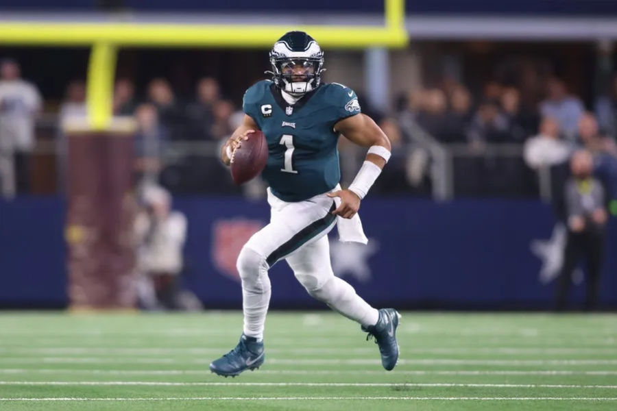 Philadelphia Eagles quarterback Jalen Hurts (1) rolls out in the game against the Dallas Cowboys at AT&T Stadium. Mandatory Credit: Tim Heitman-Imagn Images
