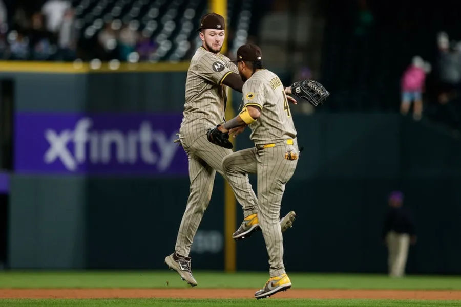 May 9, 2025; Denver, Colorado, USA; San Diego Padres center fielder Jackson Merrill (3) celebrates with first baseman Luis Arraez (4) after the game against the Colorado Rockies at Coors Field. Mandatory Credit: Isaiah J. Downing-Imagn Images