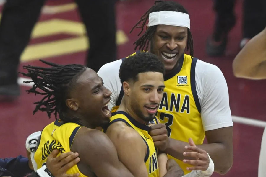 May 6, 2025; Cleveland, Ohio, USA; Indiana Pacers guard Tyrese Haliburton (center) celebrates the game-winning three-point basket with forward Aaron Nesmith (23) and center Myles Turner (33) after game two of the second round of the 2025 NBA Playoffs against the Cleveland Cavaliers at Rocket Arena. Mandatory Credit: David Richard-Imagn Images