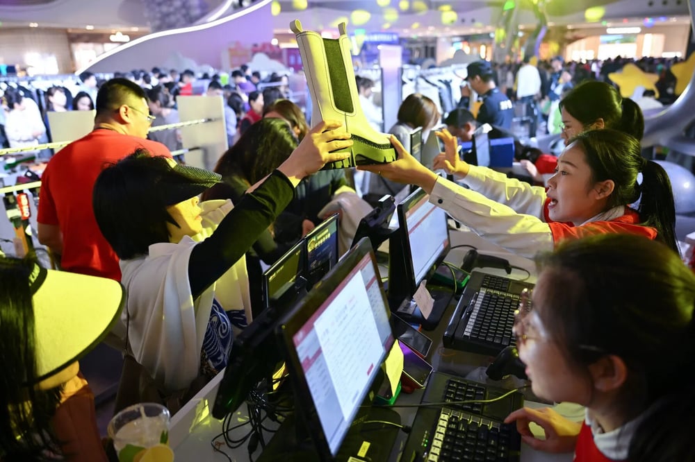 Customers shop at Haikou International Duty Free City in Hainan province in December 2024.