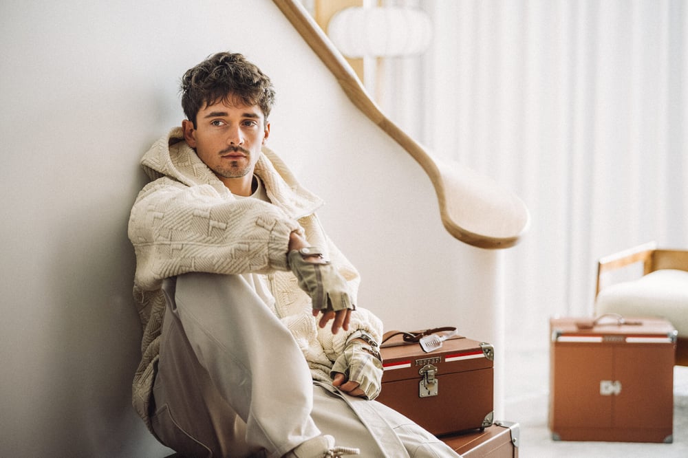Charles Leclerc wears a total look from the new capsule