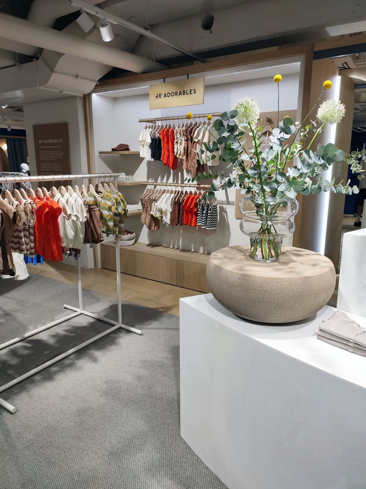 Scandinavian-inspired furnishings with floral accents at the 'Adorables' space.
