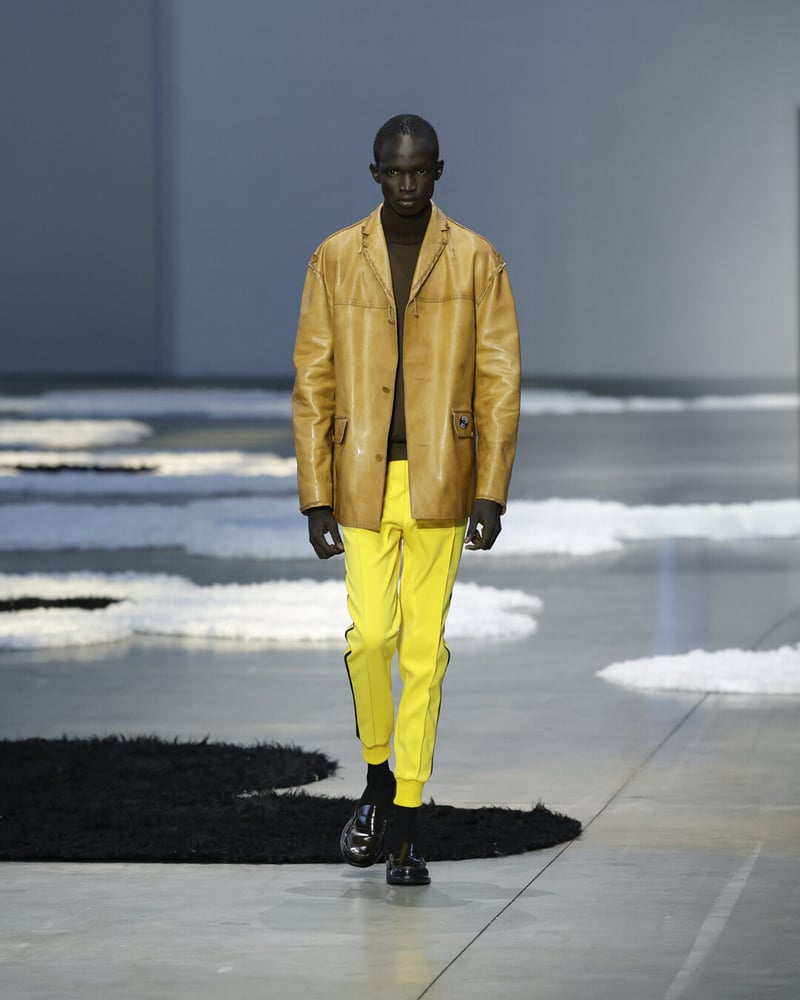 Waxy tan leather and yellow stripes bring western edge to tailored sportswear.