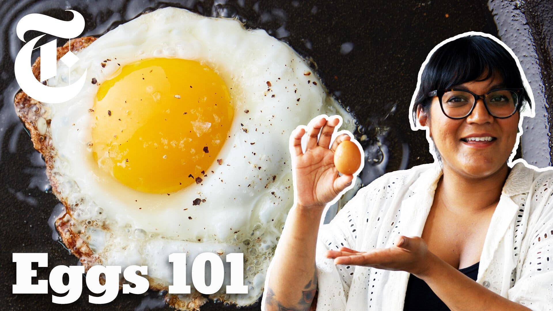 A woman in glasses stands in front of an image of a fried egg in a skillet. The bottom of the frame reads “Eggs 101.”