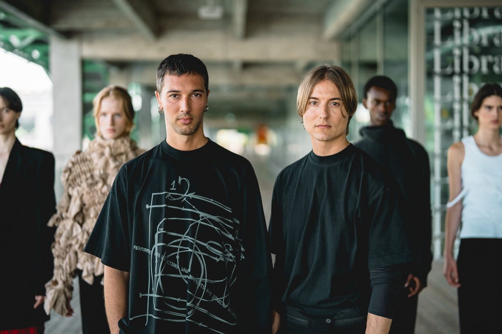 Alain Paul, on the right, in front of his creations