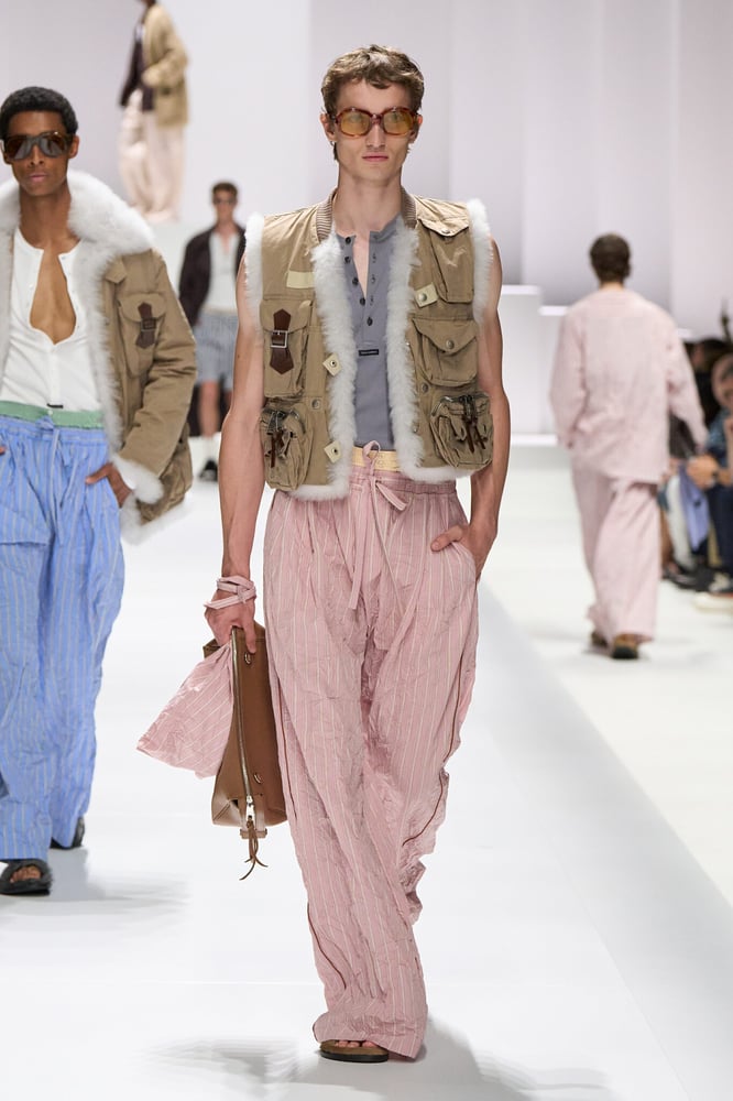 Striped pajama pants and utility vests opened the show. Dolce & Gabbana SS26.