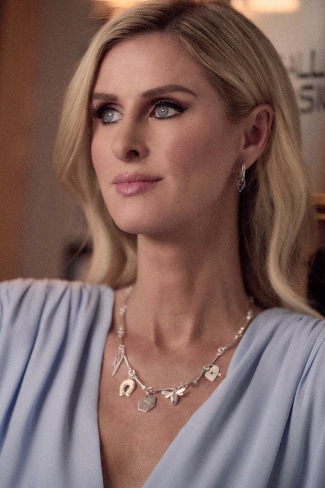 Nicky Hilton wearing a Theo Grace charm necklace