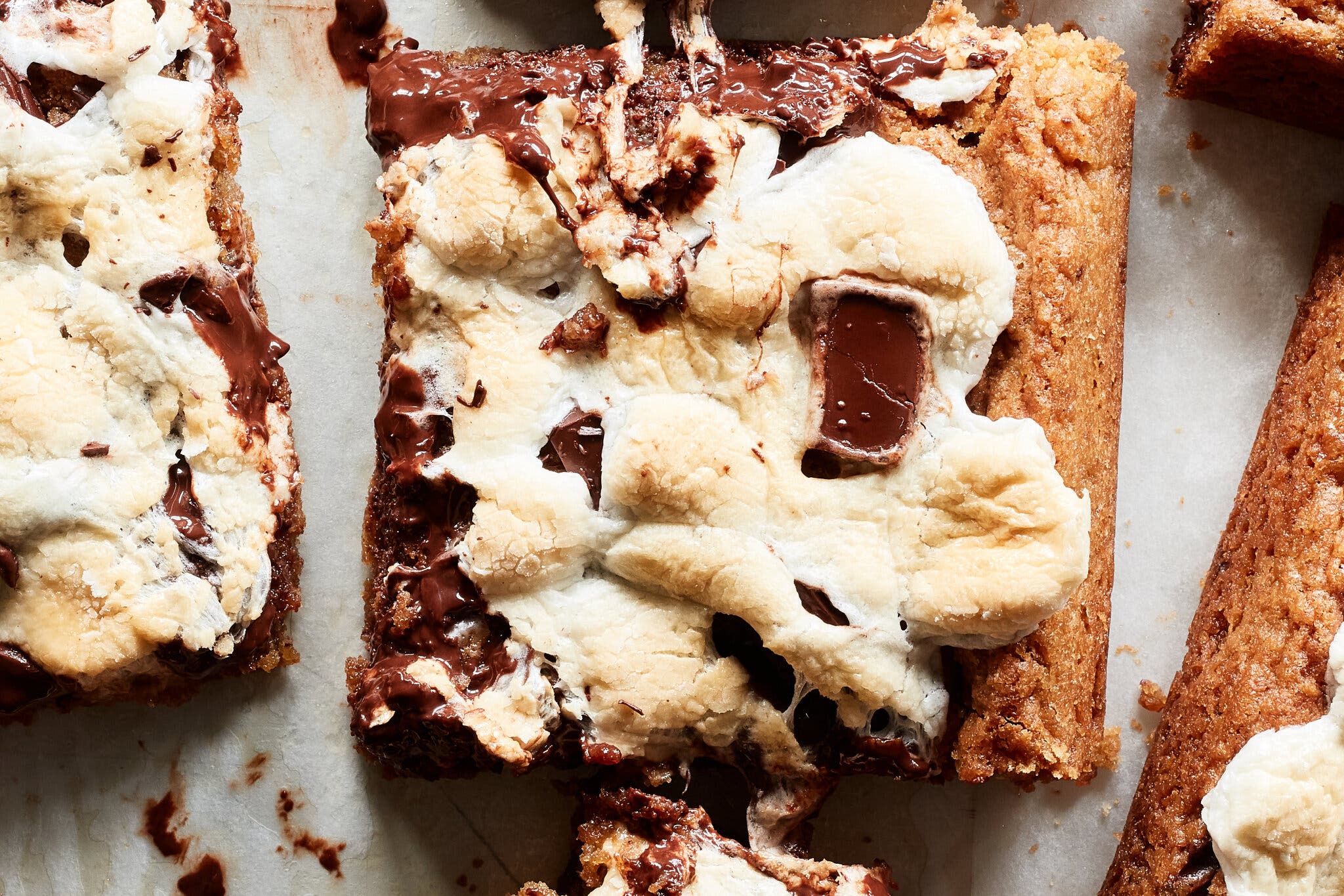 A close-up of a cut square of a s’mores blondie.