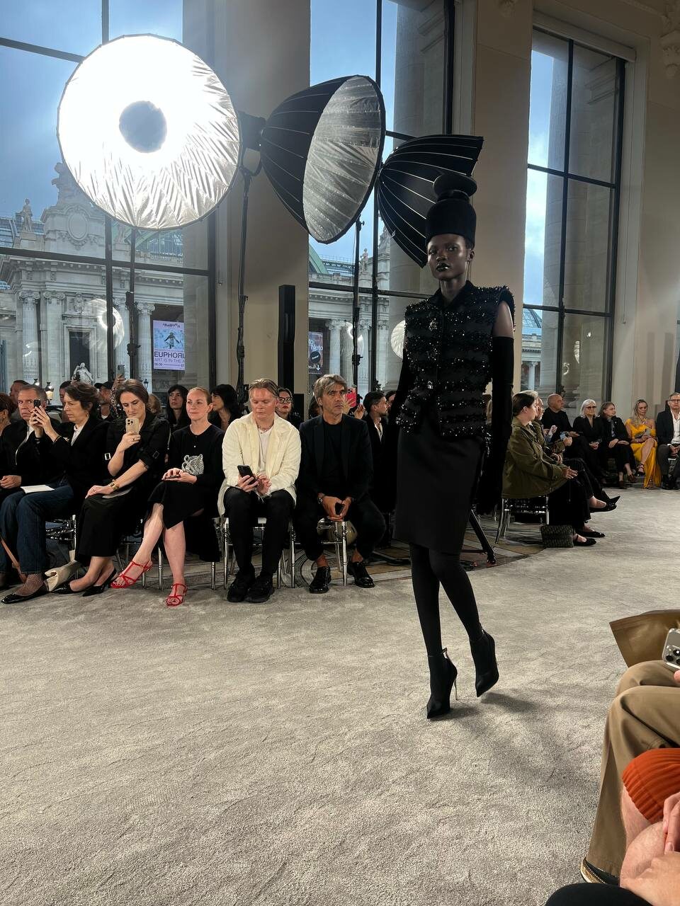 A black wool look styled with a cloche hat and opera gloves.